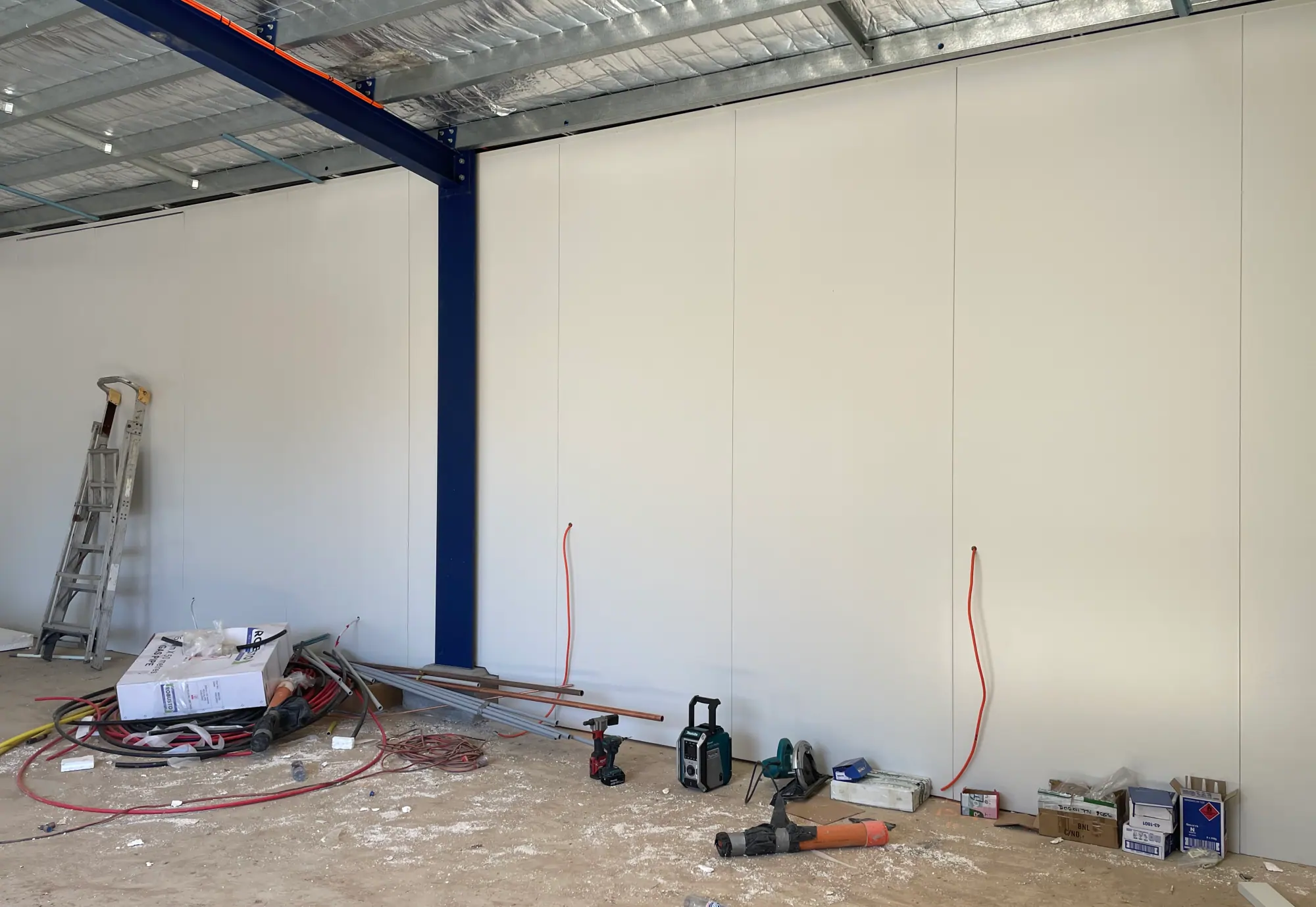 Insulated partition walls dividing a commercial warehouse space